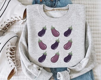 Diseño PNG de sublimación con estampado de berenjena, camiseta con estampado vegetal repetido (descarga digital)