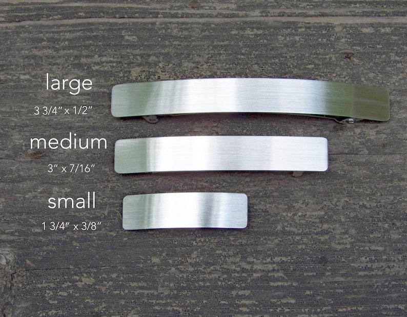 May include: Three silver metal hair clips in different sizes: large (3 3/4 inches by 1/2 inch), medium (3 inches by 7/16 inch), and small (1 3/4 inches by 3/8 inch).