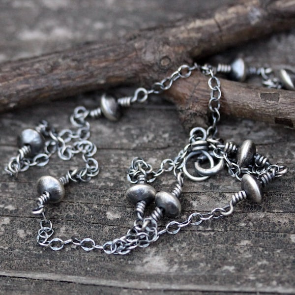 Sterlingzilveren ketting met schotelkralen en laagjes