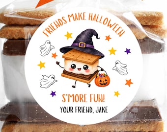 May include: A clear plastic treat bag containing s'mores, tied with an orange ribbon. A circular sticker features a cartoon s'more wearing a witch hat, holding a pumpkin bucket, surrounded by ghosts and stars, with text reading FRIENDS MAKE HALLOWEEN S'MORE FUN! YOUR FRIEND, JAKE.