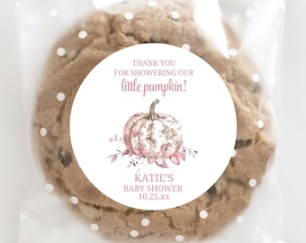 May include: A chocolate chip cookie in a clear cellophane bag with white polka dots. A round sticker on the cookie reads "Thank you for showering our little pumpkin!" with a floral pumpkin illustration and "Katie's Baby Shower 10.25.xx".