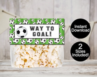 May include: Printable soccer-themed popcorn bag favor label with green and white stripes and black and white soccer balls. The label says "Way to Goal!" in black text.