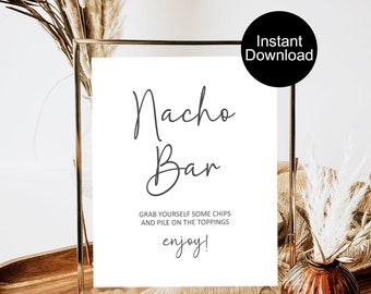 May include: A white sign in a gold frame with the words "Nacho Bar" in elegant script. Below, the text reads "Grab yourself some chips and pile on the toppings, enjoy!" A black circle with "Instant Download" is in the upper right.