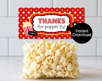 May include: A clear plastic bag filled with popcorn, with a red and white label that says "Thanks for poppin' by!" The label has a popcorn graphic and a black circle that says "Instant Download".
