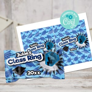 May include: A blue and white candy wrapper with a graduation cap design. The wrapper says "Julie's Class Ring" and "20xx" in black text. The wrapper is for a candy ring.