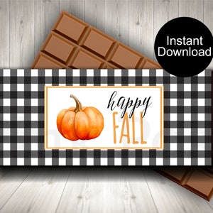 May include: Printable chocolate bar wrapper with a black and white buffalo plaid pattern. The wrapper features a pumpkin and the text "happy fall" in orange.