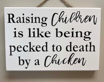 Raising children like being pecked to death by chicken sign wood