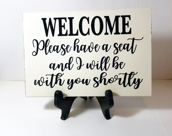 Welcome Please have a seat and I will be with you shortly sign wood