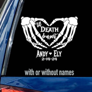 May include: White skeleton hands holding a heart with the text "Til Death Do Us Part" and the names "Andy & Ely" and the date "2-14-24" below.