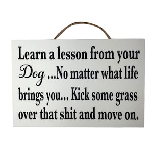 Funny Dog Lesson Wood Sign: Kick grass over shit and move on