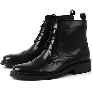 May include: Black leather lace-up boots with a brogue design and a pointed toe.