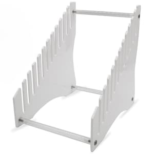 May include: White acrylic knife holder with clear acrylic rods. The holder has slots for holding knives and is angled for easy access.