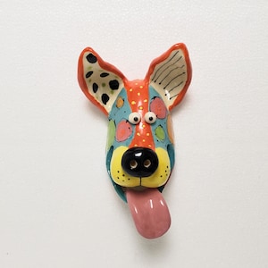 Handmade Ceramic Dog Face Wall Hanging: Turquoise & Red-Orange, 8.75&quot;