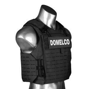 May include: Black tactical vest with the text "DOMELCO" on the front. The vest is displayed on a mannequin and features a modular design with multiple attachment points. The vest is designed for protection and is made of durable material.