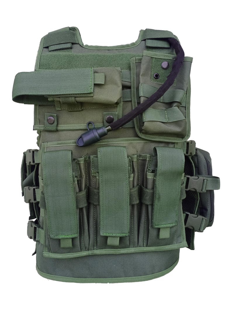 May include: Green tactical vest with multiple pouches, straps, and a hydration system. Features adjustable straps, multiple magazine pouches, and a front closure. The vest is designed for utility and protection.