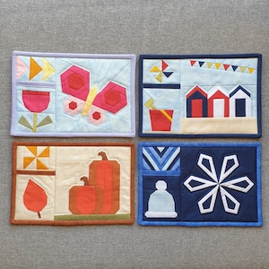 Mug Rugs (vol 1) - Four Seasons FPP Pocket Mug Rugs eBook. Features four different designs with twelve quilt blocks in total.
