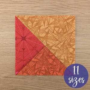 May include: A square fabric patchwork block with two triangles of different patterned fabrics. One triangle is red with a starburst design, and the other is orange with a geometric pattern. A blue circle with the text "11 sizes" is in the lower right corner.