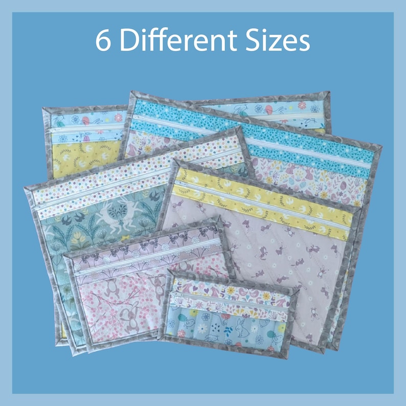 May include: A collection of six quilted fabric pouches in various sizes. Each pouch features a unique combination of pastel colors, floral and animal patterns, and a gray border. The text "6 Different Sizes" is displayed at the top.