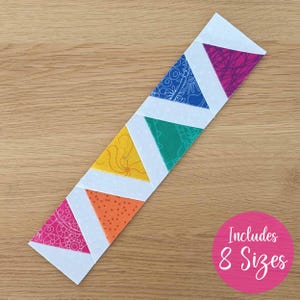 May include: A colorful fabric strip with alternating triangles in pink, orange, yellow, green, and blue, separated by white strips. The triangles feature patterned designs. A pink circle with the text "Includes 8 Sizes" is in the lower right corner.