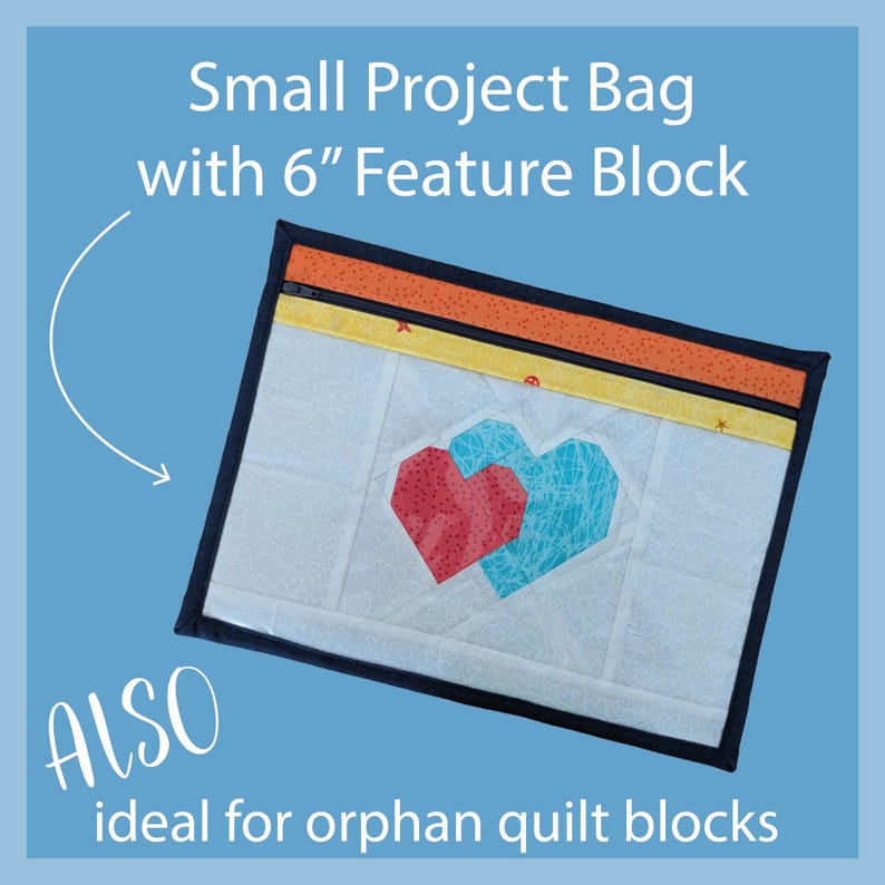 May include: A small project bag with a 6-inch feature block. The bag has a white background with two geometric hearts in red and turquoise. The top has orange and yellow accents with a black border. Text on the bag says "Small Project Bag with 6" Feature Block" and "ALSO ideal for orphan quilt blocks."