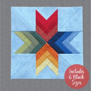 May include: A colorful quilt block pattern with a star shape in the center. The star is made up of red, orange, yellow, green, blue, and light blue fabric. The background is a light blue fabric. The text "Includes 6 Block Sizes" is in a red circle in the lower right corner.