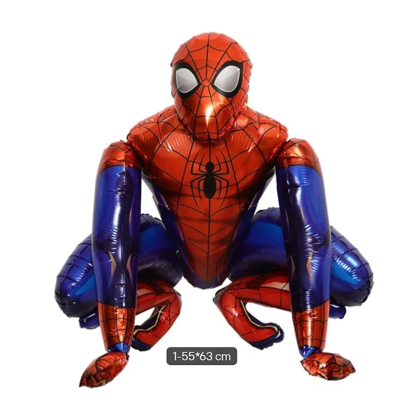 May include: A foil balloon shaped like a crouching superhero character with a red and blue suit, black web patterns, and white eyes. The character has a black spider emblem on the chest. A label at the bottom displays the text 1-55*63 cm.