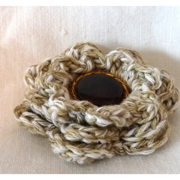 Crocheted brooch with vintage button