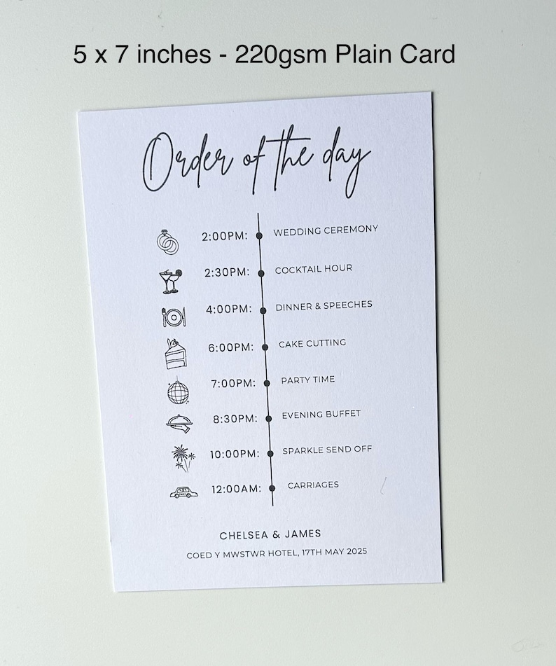 May include: A white card with a black and white order of the day schedule for a wedding. The schedule includes the wedding ceremony, cocktail hour, dinner and speeches, cake cutting, party time, evening buffet, sparkle send off, and carriages. The card also includes the names Chelsea & James and the date 17th May 2025.