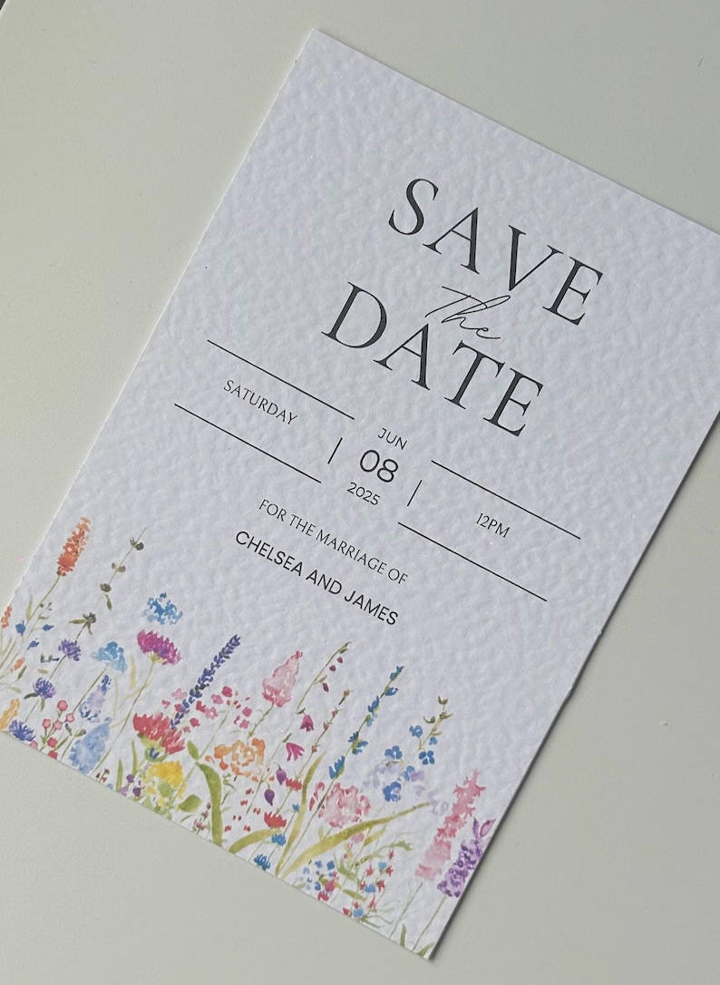 May include: Save the Date card with a watercolor floral design. The card is white with black text that reads "Save the Date", "Saturday", "June 08, 2025", "12PM", and "For the marriage of Chelsea and James".
