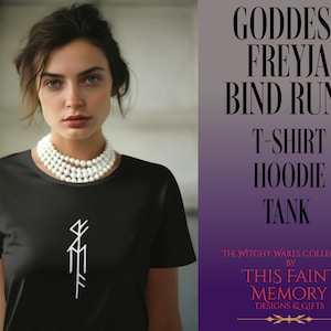 May include: Black t-shirt with a white Freya bind rune symbol. The t-shirt is part of the Witchy Wares Collection by This Faint Memory Designs & Gifts.