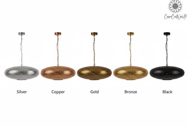 May include: Five oval-shaped pendant lights hanging from chains, each featuring a textured metallic finish. The colors from left to right are silver, copper, gold, bronze, and black. Each lamp has a matching circular ceiling canopy.