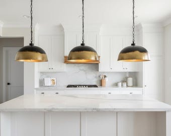 Handcrafted solid brass dome pendant light with matte black exterior & raw golden brass interior. Perfect for kitchen islands dining rooms