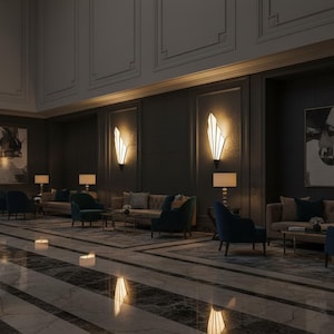 May include: A hotel lobby interior featuring dark gray walls, marble flooring, and multiple seating areas with tufted beige sofas and navy blue armchairs. Wall-mounted fan-shaped light fixtures provide warm illumination above the furniture.