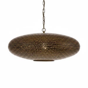 May include: A round, flattened pendant light fixture with a dark bronze finish. The metal surface is densely covered in small, uniform perforations that allow light to pass through. The fixture is suspended from a matching dark metal chain.