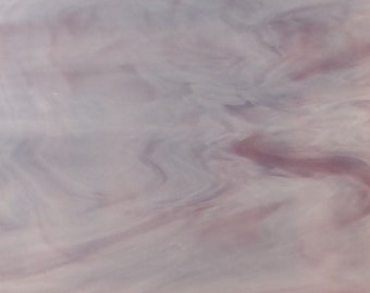 May include: A white, pink, and purple marbled sheet of acrylic with a handwritten number "84" in the top left corner.
