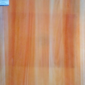 May include: A rectangular sheet of stained glass with a warm color palette. The glass features vertical streaks of orange, yellow, and white, creating a textured, translucent appearance. The overall effect is reminiscent of sunlight filtering through a window.
