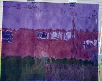 May include: A large, rectangular, purple-tinted glass panel with a rippled surface. The panel reflects a blurred outdoor scene with shades of purple, red, green, and blue. The glass is resting on a light purple base.