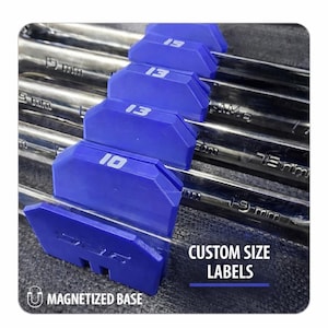 May include: A set of chrome wrenches with blue custom size labels. The labels display sizes like 10 and 13. The text "Custom Size Labels" is visible. The base of the labels is magnetized.