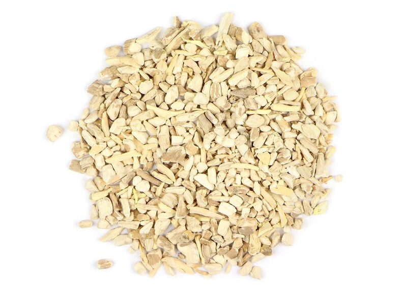 May include: A close-up of a pile of dried, light brown, and beige root pieces. The root pieces are irregularly shaped and have a rough texture.