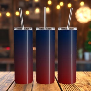 May include: Three stainless steel tumblers with a red to blue ombre design. The tumblers have lids and straws.
