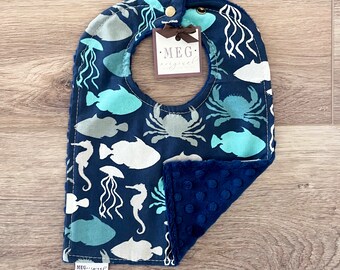 Adjustable Snap Bib { Sea Life } Grows with Baby into a Toddler - Soft & Durable -Absorbent Cotton Print on Navy Minky Backing-Fish, Sharks