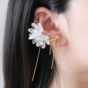 May include: A set of three ceramic nesting bowls in shades of blue, green, and white. The bowls feature a speckled glaze and a simple, modern design. The largest bowl measures approximately 6 inches in diameter.