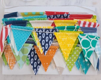 Mini Flag Bunting, Boy Prints Only, 10 feet of small flags in red, blues, greens, orange, yellow.
