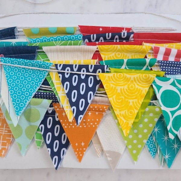 Mini Flag Bunting, Boy Prints Only, 10 feet of small flags in red, blues, greens, orange, yellow.