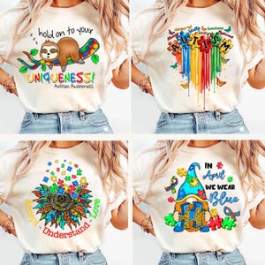 K&ouml;nnte beinhalten: Vier verschiedene Designs von T-Shirts mit Autismus-Bewusstseins-Motiven. Das erste Design zeigt einen Faultier, der auf einem Puzzle-St&uuml;ck-Ast schl&auml;ft, mit dem Text "hold on to your UNIQUENESS! Autism Awareness". Das zweite Design zeigt ein Regenbogenherz aus Puzzle-St&uuml;cken mit dem Wort "AUTISM" darin. Das dritte Design zeigt eine Sonnenblume mit Puzzle-St&uuml;cken als Bl&uuml;tenbl&auml;tter und dem Text "Accept - Understand - Love". Das vierte Design zeigt einen Zwerg, der ein Puzzle-St&uuml;ck h&auml;lt, mit dem Text "IN April WE WEAR Blue".