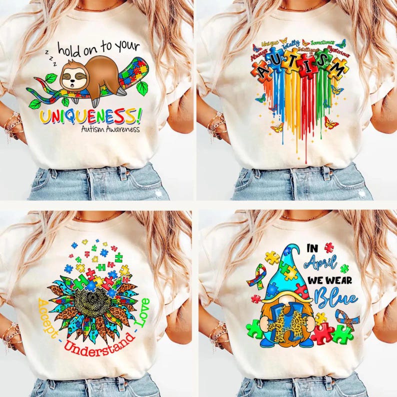 K&ouml;nnte beinhalten: Vier verschiedene Designs von T-Shirts mit Autismus-Bewusstseins-Motiven. Das erste Design zeigt einen Faultier, der auf einem Puzzle-St&uuml;ck-Ast schl&auml;ft, mit dem Text "hold on to your UNIQUENESS! Autism Awareness". Das zweite Design zeigt ein Regenbogenherz aus Puzzle-St&uuml;cken mit dem Wort "AUTISM" darin. Das dritte Design zeigt eine Sonnenblume mit Puzzle-St&uuml;cken als Bl&uuml;tenbl&auml;tter und dem Text "Accept - Understand - Love". Das vierte Design zeigt einen Zwerg, der ein Puzzle-St&uuml;ck h&auml;lt, mit dem Text "IN April WE WEAR Blue".