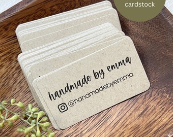 May include: A stack of mini business cards printed on brown kraft cardstock. The cards feature the text "handmade by emma" and the social media handle "@handmadebyemma". The cards measure 2.25 inches by 1.25 inches.