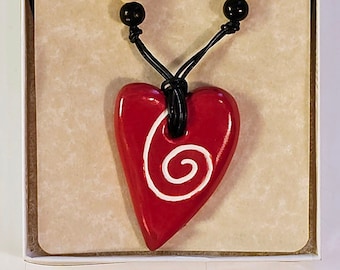 Heart shaped ceramic pendant necklace with spiral and beads