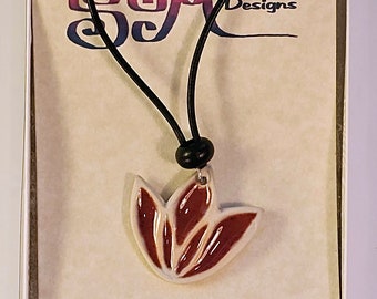 Lotus flower motif ceramic pendant necklace on leather cord