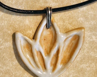 Lotus flower motif ceramic pendant necklace on leather cord